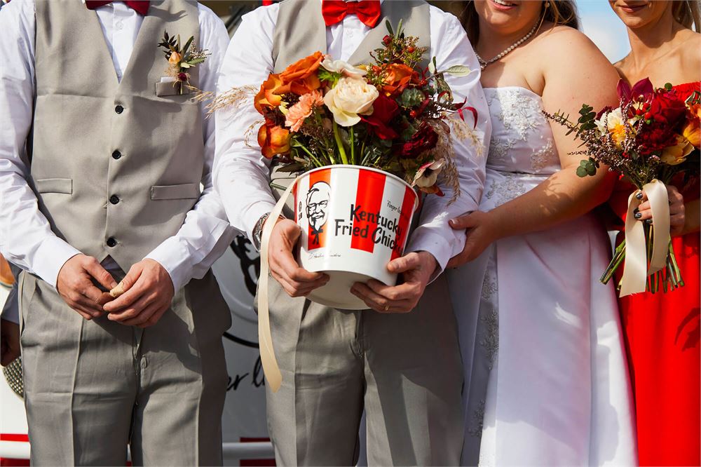 Couple put a wing on it with a KFC-themed wedding